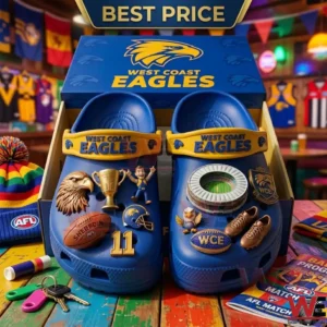 Blue sports team themed foam clogs with various miniature decorative charms on a wooden surface!
