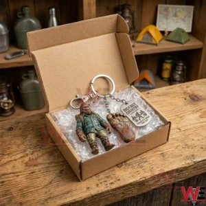 Bigfoot themed keychain set inside a cardboard gift box with bubble wrap