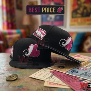 Two black Montreal Expos baseball caps resting on a table with vintage tickets.