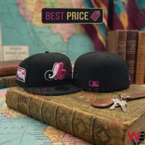 Black Montreal Expos Bright Rose Pink Logo Cap 8 Two black Montreal Expos baseball caps displayed on an antique book