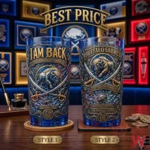 Two Buffalo Sabres themed collector glasses with intricate team imagery on a wooden desk.