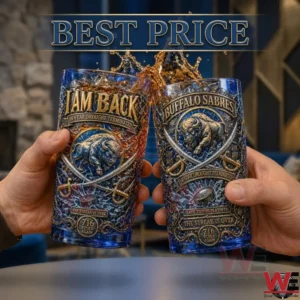 Two hands holding Buffalo Sabres themed drinking glasses with celebratory splashes of amber liquid.