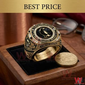 Gold and black sports memorabilia ring with bird logo in a wooden display box!