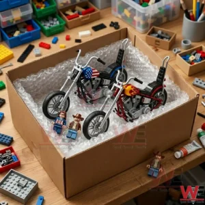 Two custom toy motorcycles with minifigures packed in a cardboard box with bubble wrap on a desk.