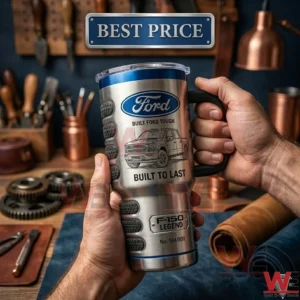 Man holding a stainless steel travel tumbler with Ford F-150 branding in a workshop