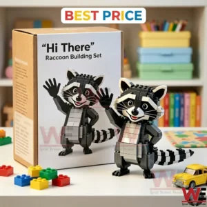 A grey and black raccoon building block figure waving next to its retail box on a table.