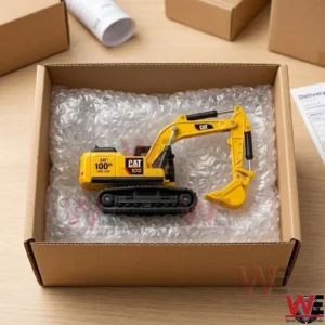 Caterpillar 100th anniversary yellow excavator die-cast model in a shipping box