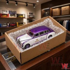 A limited edition purple and white die-cast collectible car model in a cardboard box.