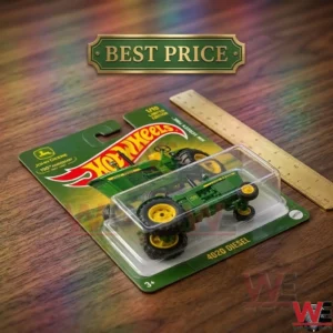 John Deere 4020 Diesel die-cast tractor in blister packaging on wood table