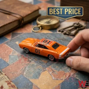 Orange 1969 Dodge Charger General Lee toy car being held by a hand