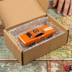 Orange General Lee die-cast car in a shipping box