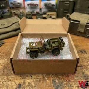 Olive drab military jeep toy in an open cardboard shipping box
