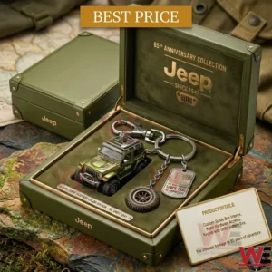 Open green luxury gift box containing a miniature Jeep model and a themed keychain with a tire and dog tag!