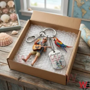 Jimmy Buffett inspired keychain with acoustic guitar, parrot, and drink accessories in a shipping box