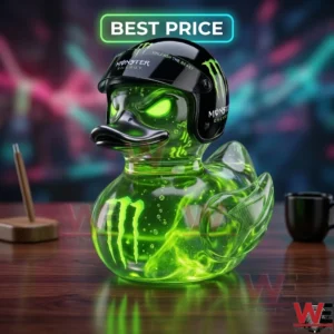 A glowing green monster energy themed rubber duck wearing a black helmet on a desk.