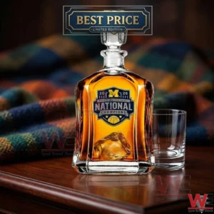 Michigan Wolverines National Champions commemorative whiskey decanter set on a wooden table.