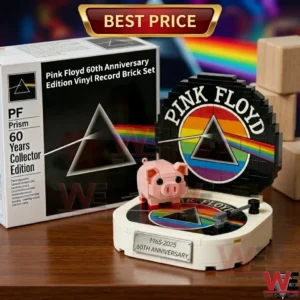 A commemorative brick set of a Pink Floyd record player with a pink pig and anniversary plaque next to its box!
