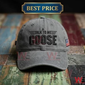 Charcoal grey baseball cap with black talk to me goose embroidery on a colorful rustic wooden table!
