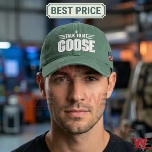 Front view of a man wearing a forest green baseball cap with white talk to me goose text!