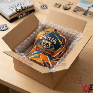Route 66 commemorative baseball cap inside a cardboard shipping box.