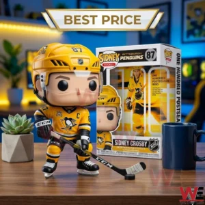 Hockey player vinyl figure with stick and puck next to a display box on a desk!