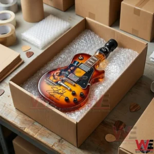 A Jack Daniel's Tennessee Whiskey themed electric guitar collectible inside a shipping box