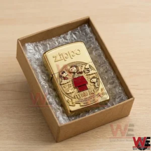 Gold Zippo lighter featuring Snoopy Flying Ace 75th Anniversary design in protective gift box
