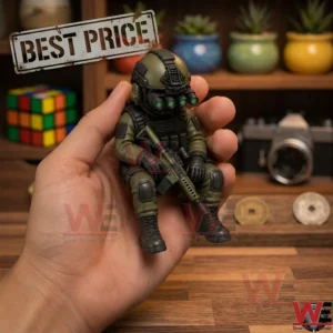 A hand holding a miniature tactical soldier figurine with night vision goggles and a rifle.