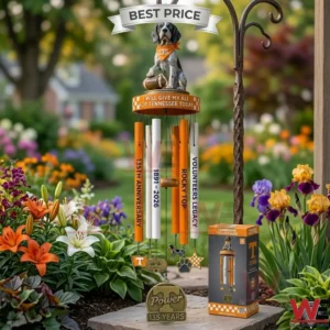 A Tennessee Volunteers themed wind chime with a dog mascot statue hanging in a colorful garden.