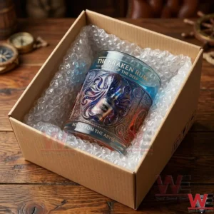 The Kraken Rum branded glass with octopus relief design in a cardboard shipping box.