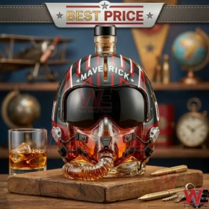 Top Gun pilot helmet shaped glass liquor decanter on a wooden desk.