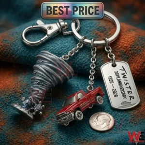 A movie themed silver keychain with a tornado and a red truck on a textured cloth background.
