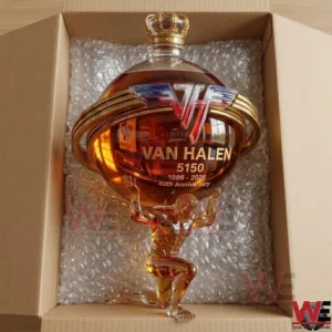 Van Halen 5150 40th anniversary glass liquor decanter supported by a kneeling atlas figure inside a shipping box.
