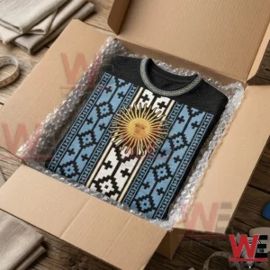 2026 FIFA World Cup Argentina Sun & Flag Ethnic Pattern T-Shirt 5 A black sweater with a blue and white patterned design featuring a sun emblem inside a shipping box.